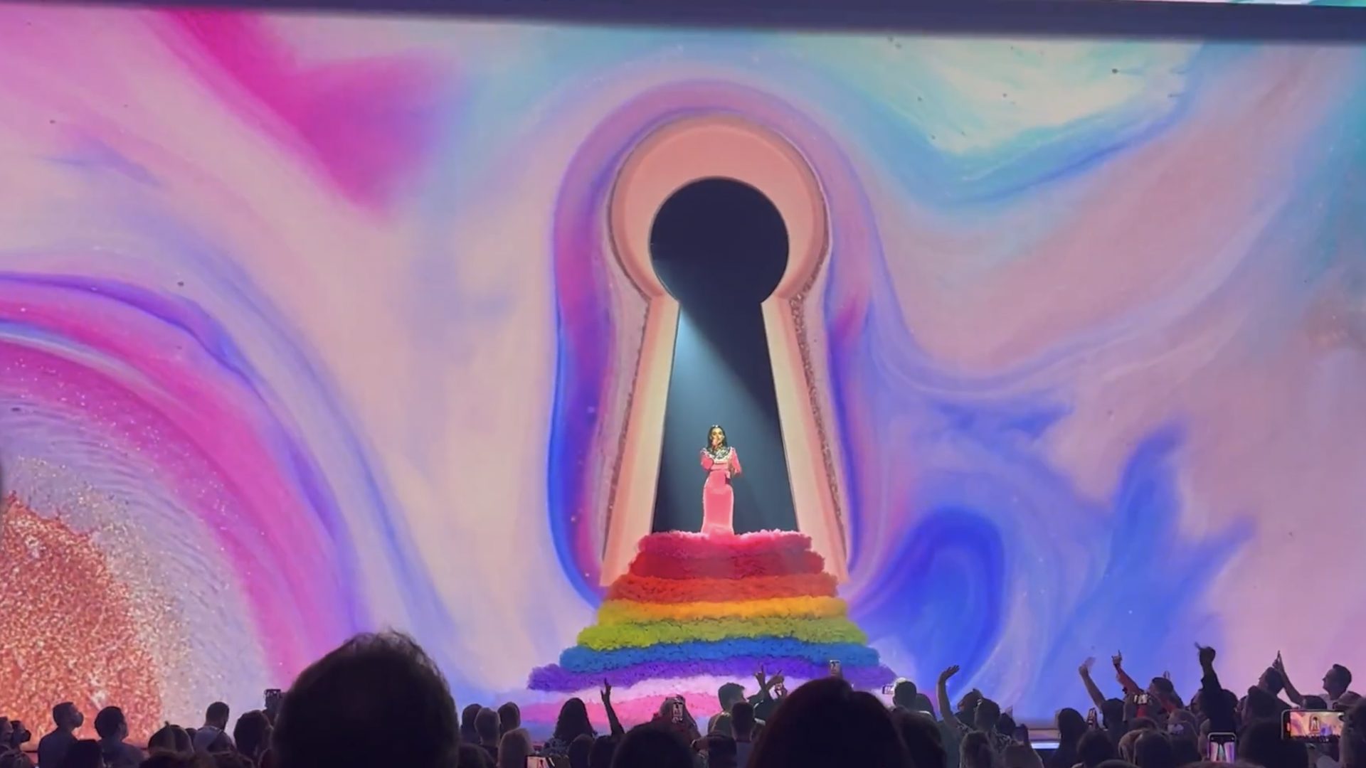 The keyhole set against swirling pastel marble on the LED wall