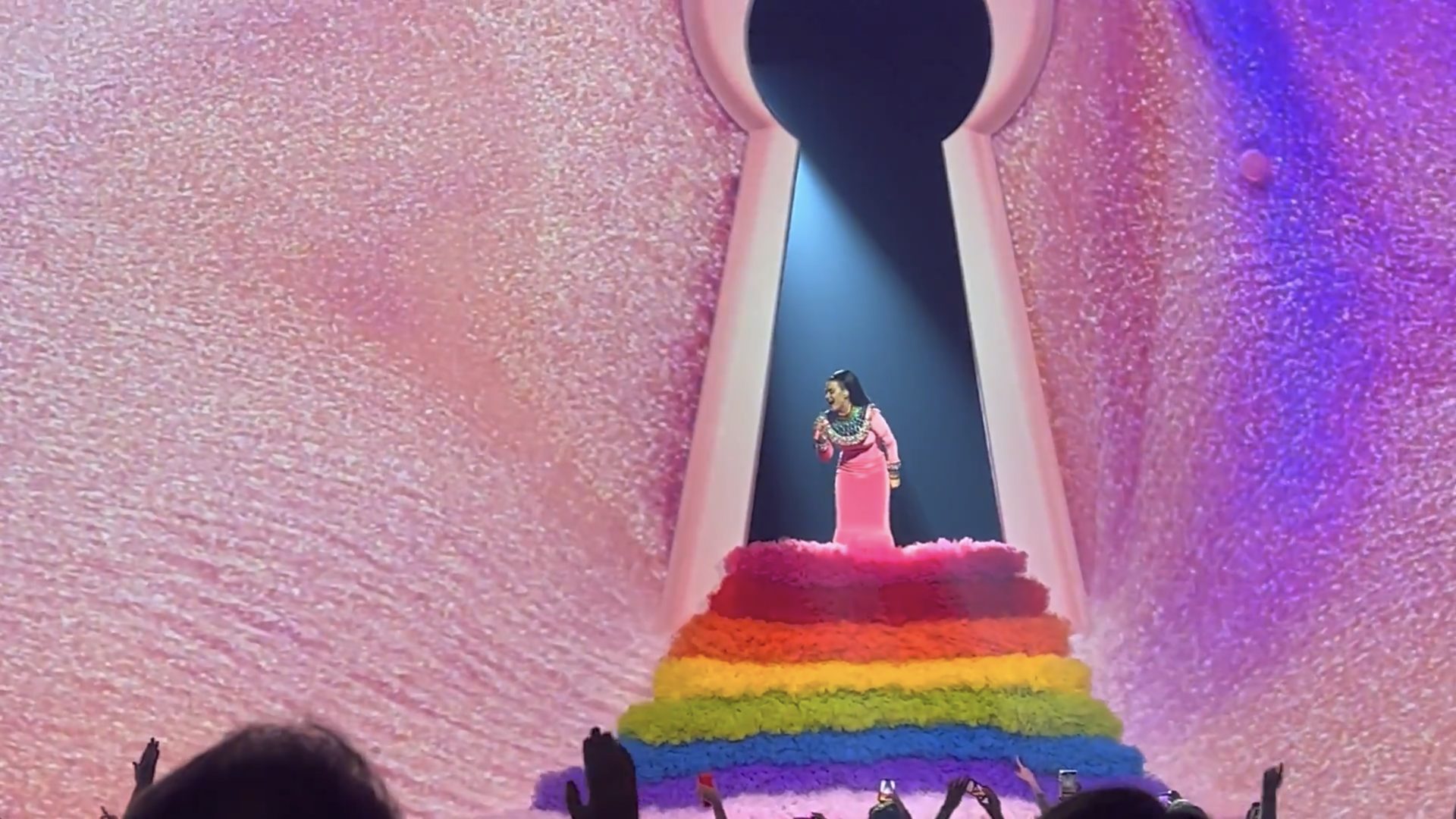 Close view of the keyhole and rainbow staircase on a glittering pink screen