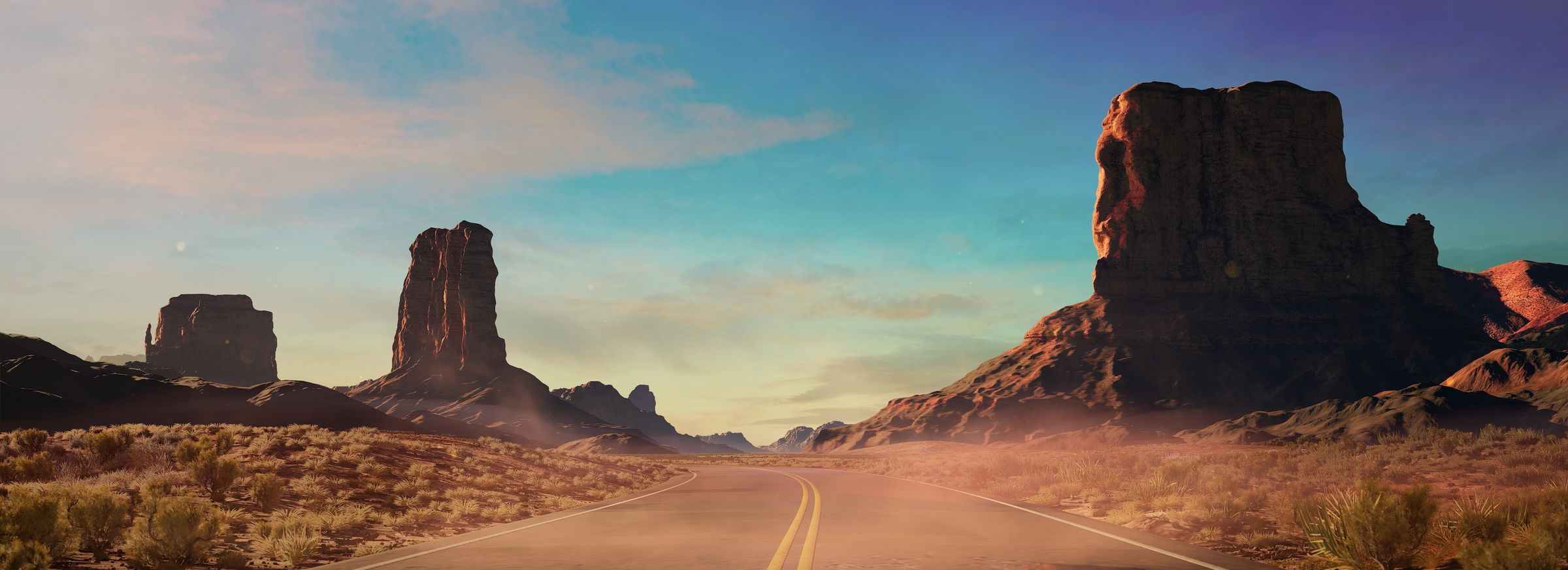 Desert highway between red rock buttes in daylight