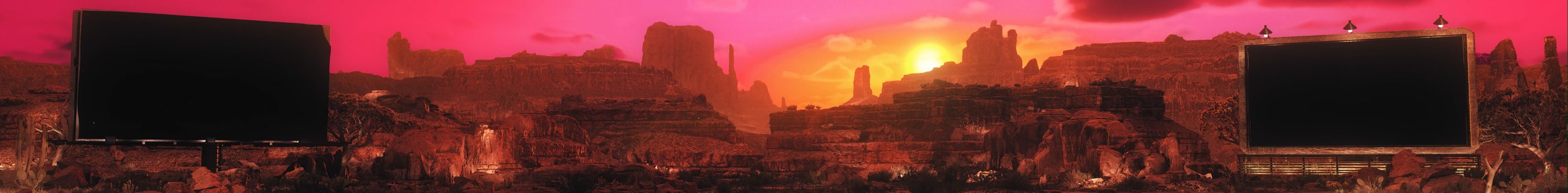 A desert canyon at sunset between two billboards